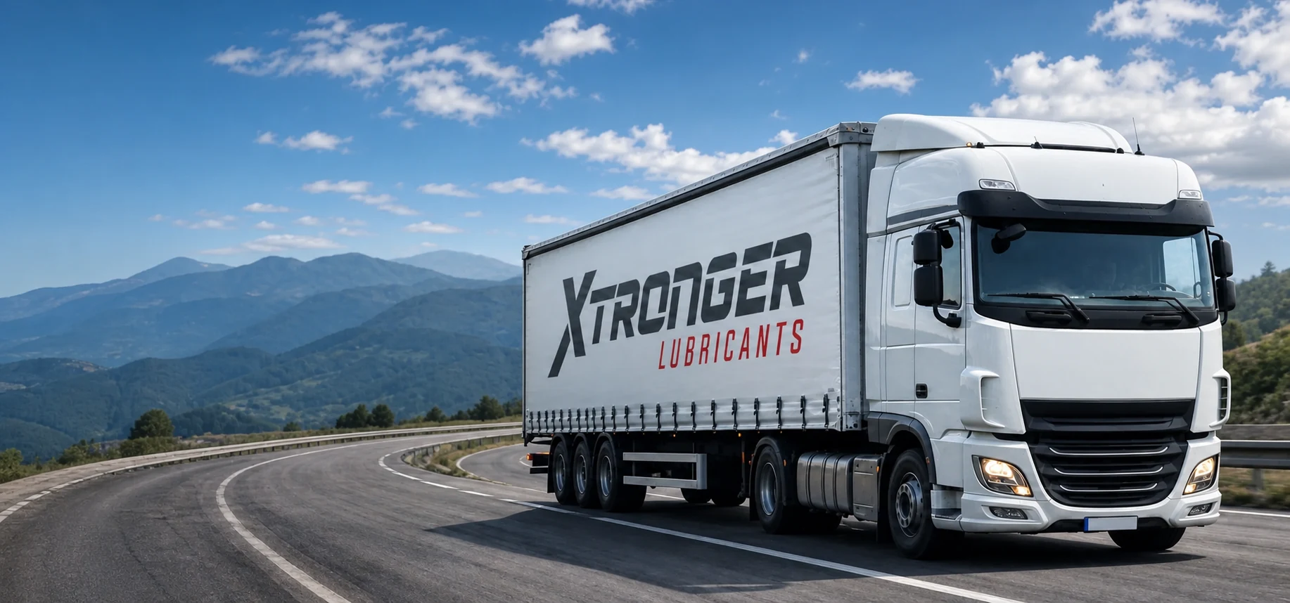 Camión de trabajo pesado Xtronger Lubricants con conductor circulando de día por una carretera de montaña